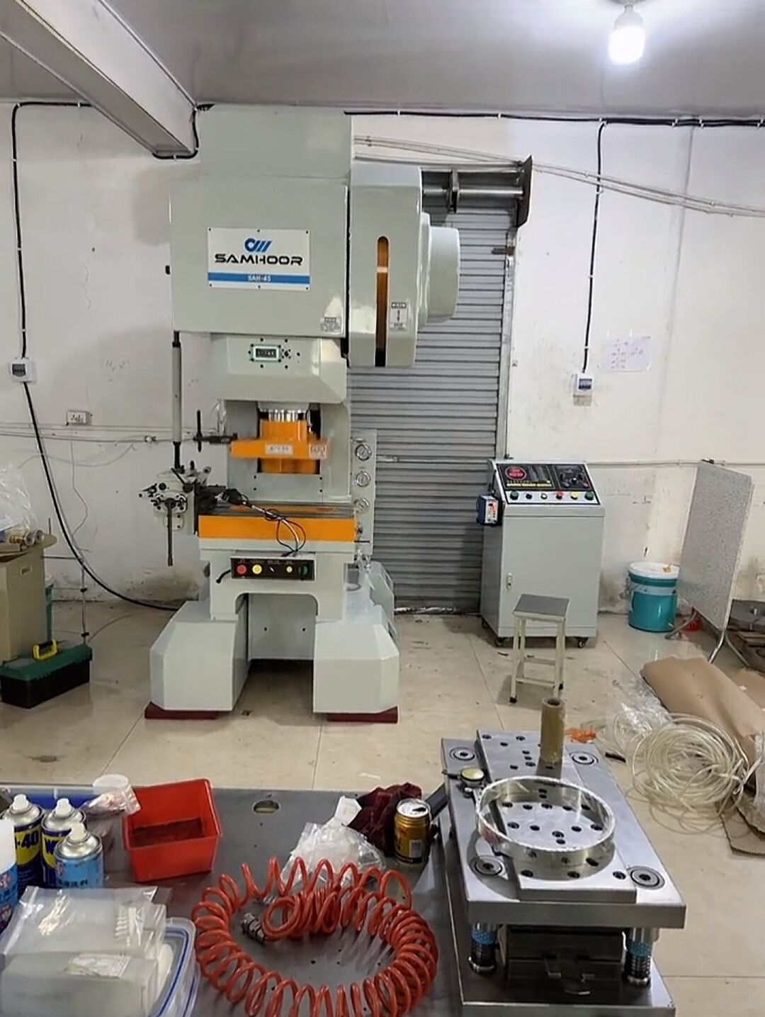 How many strokes can the stamping press make per minute?